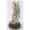 Image 1 : A Japanese carved ivory okimono, of a farmer and boy holding a prunus branch, signed, 8 ins....