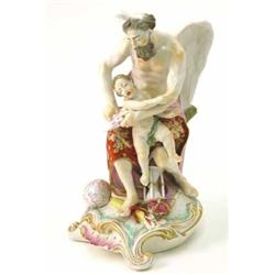 An 18th century Derby figure, "Time clipping the wings of Love", painted in enamels, on scroll ba...