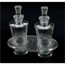 A Lalique 'Bourgueil' oil and vinegar set, cat. ref. 7501, early post-war, two bottles on stand p...