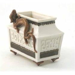 A Victorian Royal Worcester planter, Chinese design mounted with a dragon, the sides with a key p...