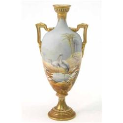 A Royal Worcester two-handled vase, painted with two herons and desert landscape in bright enamel...