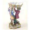 Image 1 : A 19th century Meissen figural salt, scalloped dish supported by two boys, on pierced scroll base...