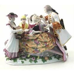 A late 19th century Meissen figure group, seated lady holding heart, attentive male courtier, fem...