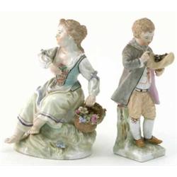 Two 19th century Berlin figures, girl seated with basket of flowers (5.5in.) and boy holding hat...