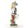 Image 1 : An old English harlequin figure, wearing chequered jacket, dancing with arm aloft, on circular ba...