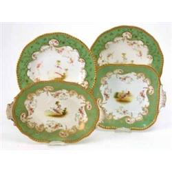 A late 19th century Coalport 13 piece part dinner service, painted with exotic birds within scrol...