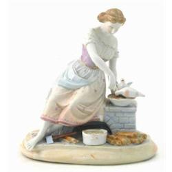 A French bisque figure of a lady, seated at fireplace, two feeding birds beside, 6.5in....
