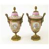 Image 1 : A pair of 19th century Sevres style ormolu mounted porcelain urns and covers, with panels of love...