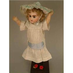 A Jumeau walking doll, impressed 3, circa1890, with glass paperweight eyes, open mouth and pierce...