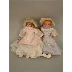 Two poured wax shoulder dolls, circa 1870, both possibly Pierotti, with fixed glass eyes, one wit...