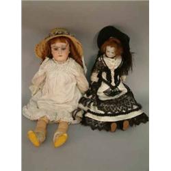 A pale bisque doll's head with fixed glass eyes, (replacement) composition body in silk evening d...