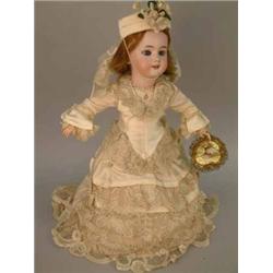 A French DEP "Jumeau" bisque doll, circa 1890 with sleeping eyes, open mouth and pierced ears, on...
