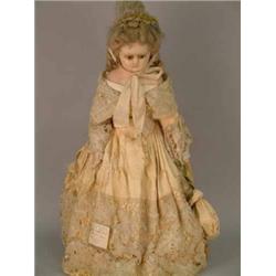 A Victorian wax and composition shoulder doll, with fixed glass paperweight eyes, painted wax low...