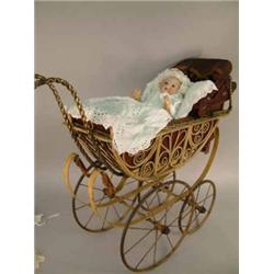 An Armand Marseille "My Dream Baby" in perambulator, doll mould 351 with open mouth and bent limb...