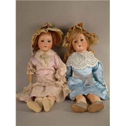 A Schoennau & Hoffmeister bisque doll, mould 914, with sleeping eyes and open mouth, (22ins) and...