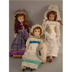 A Victorian poured wax shoulder doll, with inset glass eyes, cloth body and wax lower limbs (16in...