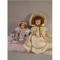 A Victorian poured wax shoulder doll, with blue glass eyes, inserted hair and cloth body with wax...