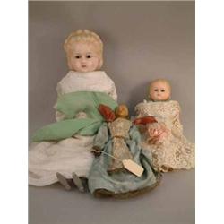 A carved wax creche doll, 17th or early 18th century, with painted features, full-length dress an...