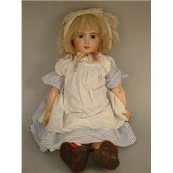 A Jumeau bisque child doll, mould 1907, with fixed brown glass eyes, open mouth, pierced ears, on...