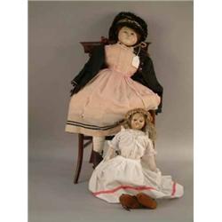 A large Victorian wax over composition shoulder doll, wire mechanism operating glass eyes, clothe...