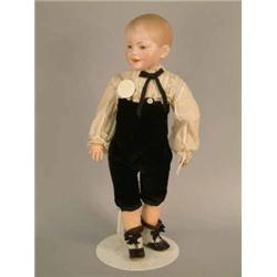 An S.F.B.J. bisque boy doll, mould 227, painted hair to domed head, fixed glass eyes and open mou...
