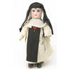 Image 1 : A Jumeau bisque character doll, dressed as a nun with pendant rosary, fixed glass eyes, open mout...