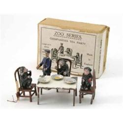A Taylor & Barrett "Chimpanzee's Tea Party", consisting of table, three chairs, three chimpanzees...