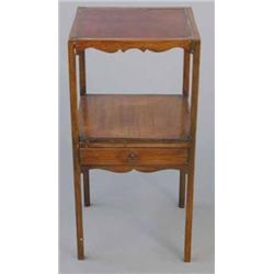 An early 19th century mahogany toilet table, with replace top and mid drawer on square tapered le...