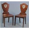 Image 1 : A pair of George III mahogany hall chairs, with shield backs painted with crests on square tapere...