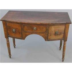 A small George III mahogany bowfront sideboard, with central drawer flanked by two deep drawers f...