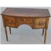 Image 1 : A small George III mahogany bowfront sideboard, with central drawer flanked by two deep drawers f...