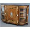 Image 1 : A Victorian figured walnut and gilt metal mounted credenza, with central door set with a Sevres s...