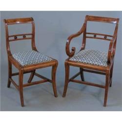 A set of six Regency mahogany dining chairs, including one with arms with ebony strung cresting r...