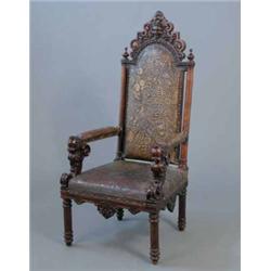 A 19th century Italian carved walnut high back chair, upholstered tooled leather seat and back, c...
