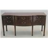 Image 1 : A late George III mahogany serpentine sideboard, with six drawers fitted brass loop handles on si...