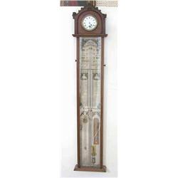 An Admiral Fitzroy barometer, with walnut case inset with a timepiece, 45ins...