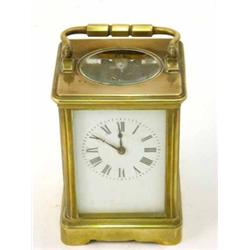 A French brass carriage clock, with enamelled Roman dial, 6ins...