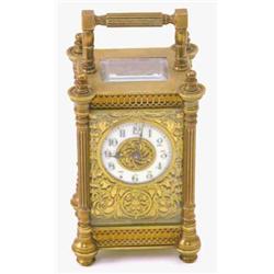 A French gilt brass carriage timepiece, with gilt scroll dial and enamelled chapter ring, 6ins...