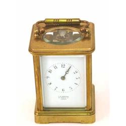A French gilt brass carriage clock, with enamelled Arabic dial, signed Bedford, Regent St, London...