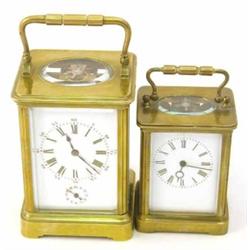 A French brass carriage alarm clock, with enamelled dial and movement striking on bell, 5.75ins a...