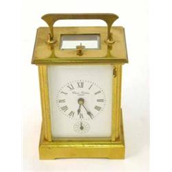 A French brass carriage alarm clock, retailed by Charles Frodsham, 6.5ins...
