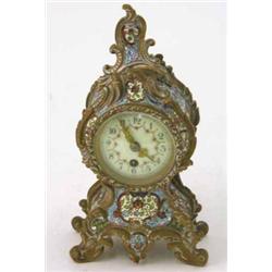 A French bronze rococo case mantel timepiece, with champleve decoration, 9ins...