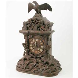 A Black Forest carved wood cuckoo mantel clock, surmounted with an eagle, 23ins...