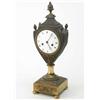 Image 1 : An early 19th century French bronze and ormolu mantel clock, in urn shaped case with enamelled Ro...