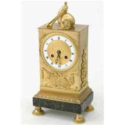A Regence ormolu mantel clock, with rectangular case decorated with pastoral motifs of a lamb and...