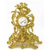 Image 1 : A 19th century French ormolu mantel clock, with asymmetrical rococo scroll case and enamelled Rom...