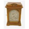 Image 1 : An Edwardian oak chiming mantel clock, with arched silvered dial and German movement, 17ins...