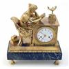 Image 1 : An early 19th century French ormolu mantel clock, modelled as a muse seated at a table with ename...
