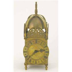 A 1920's brass lantern clock, with French movement, 10.5ins...