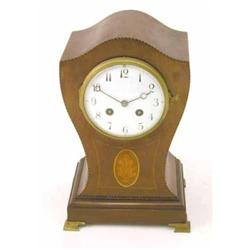 An Edwardian inlaid mahogany balloon case mantel clock, with enamelled Arabic dial, 11ins...